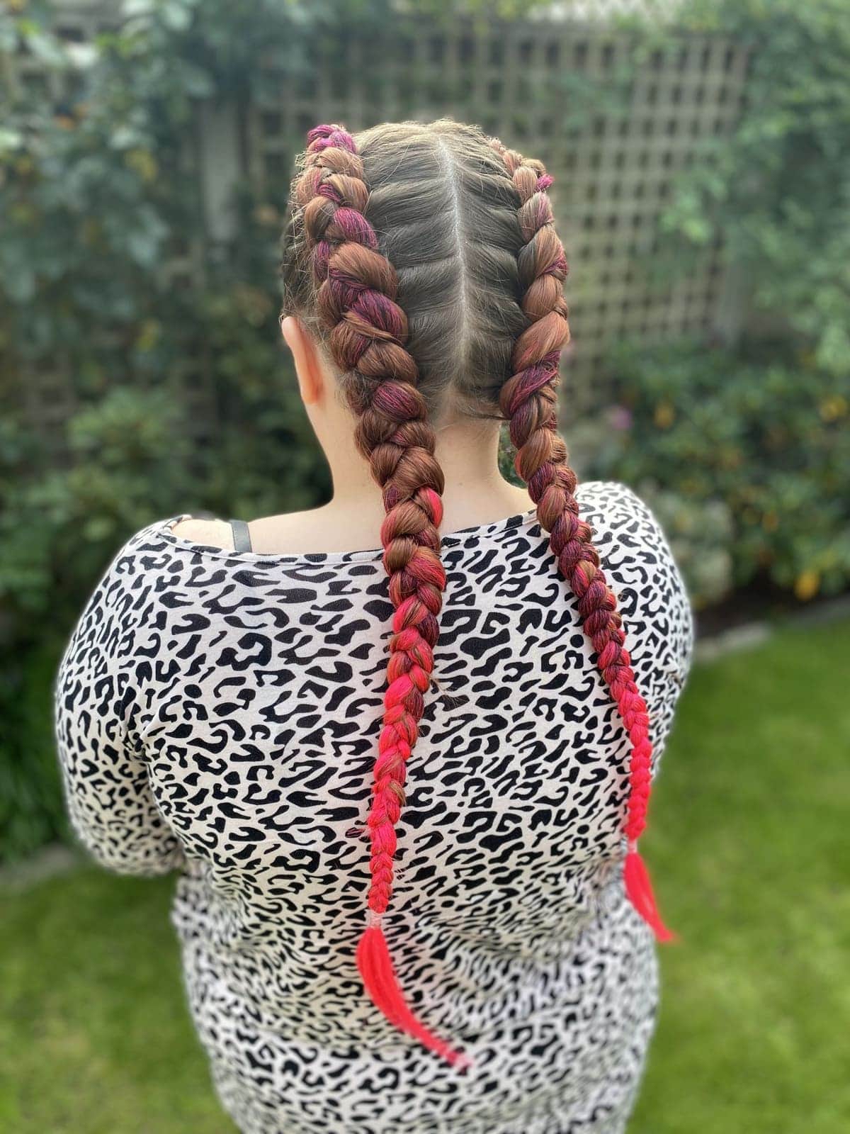 Dutch braids with red colour braided in